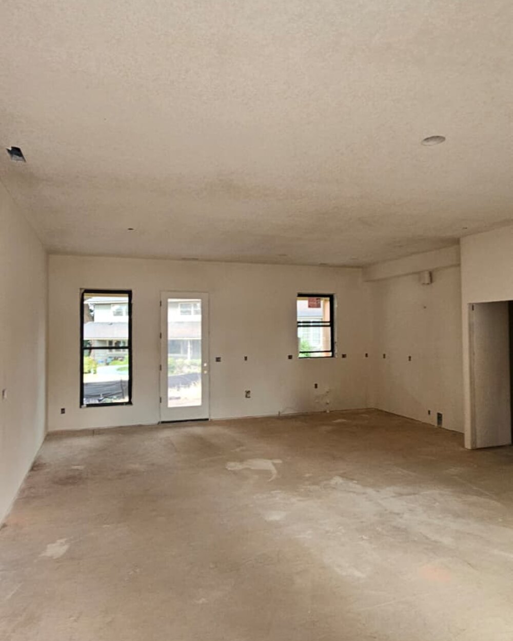 Open living area with finished walls and ceiling