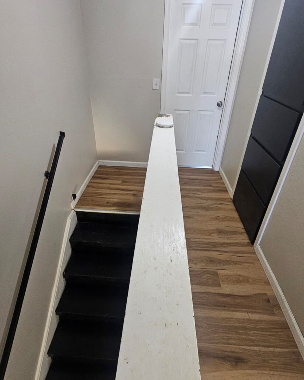 Stairway landing with new wood-look vinyl flooring