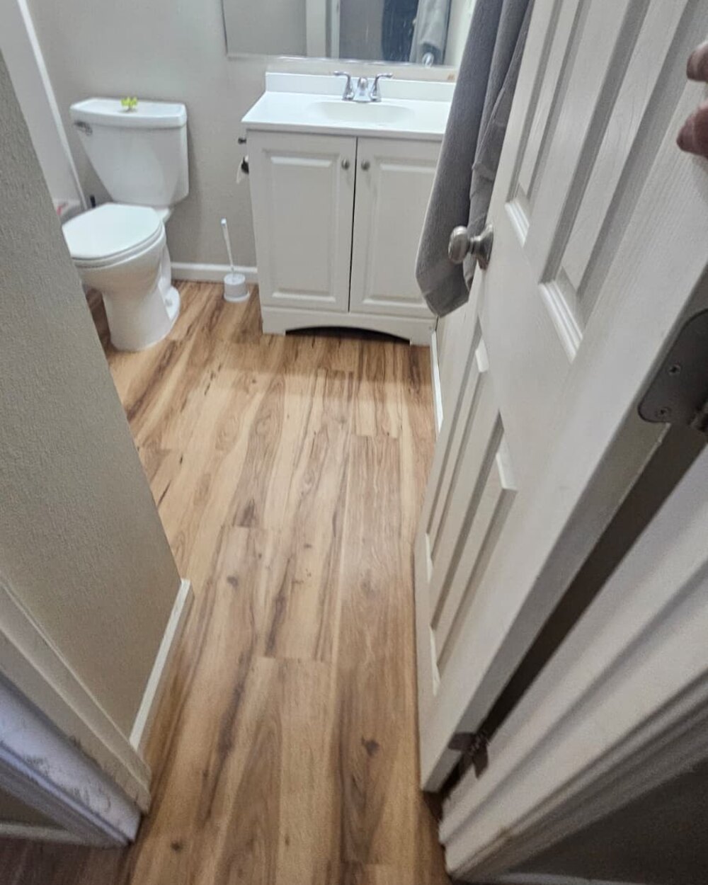 Bathroom with new wood-look vinyl plank flooring